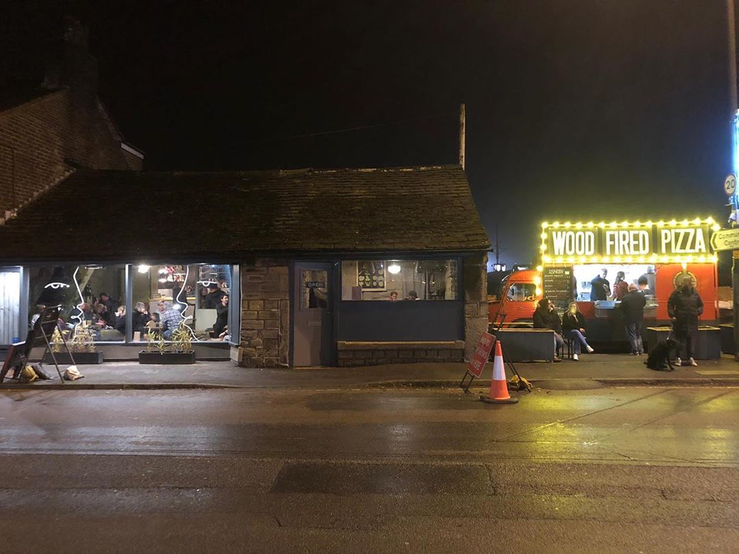 A view of the outside of the bar at night